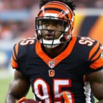 Isaiah Williams in Bengals uniform holding a football.